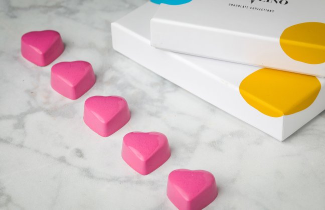 Botolino strawberry bonbons — Valrhona white chocolate with strawberry jelly, ganache, and pistachio praline