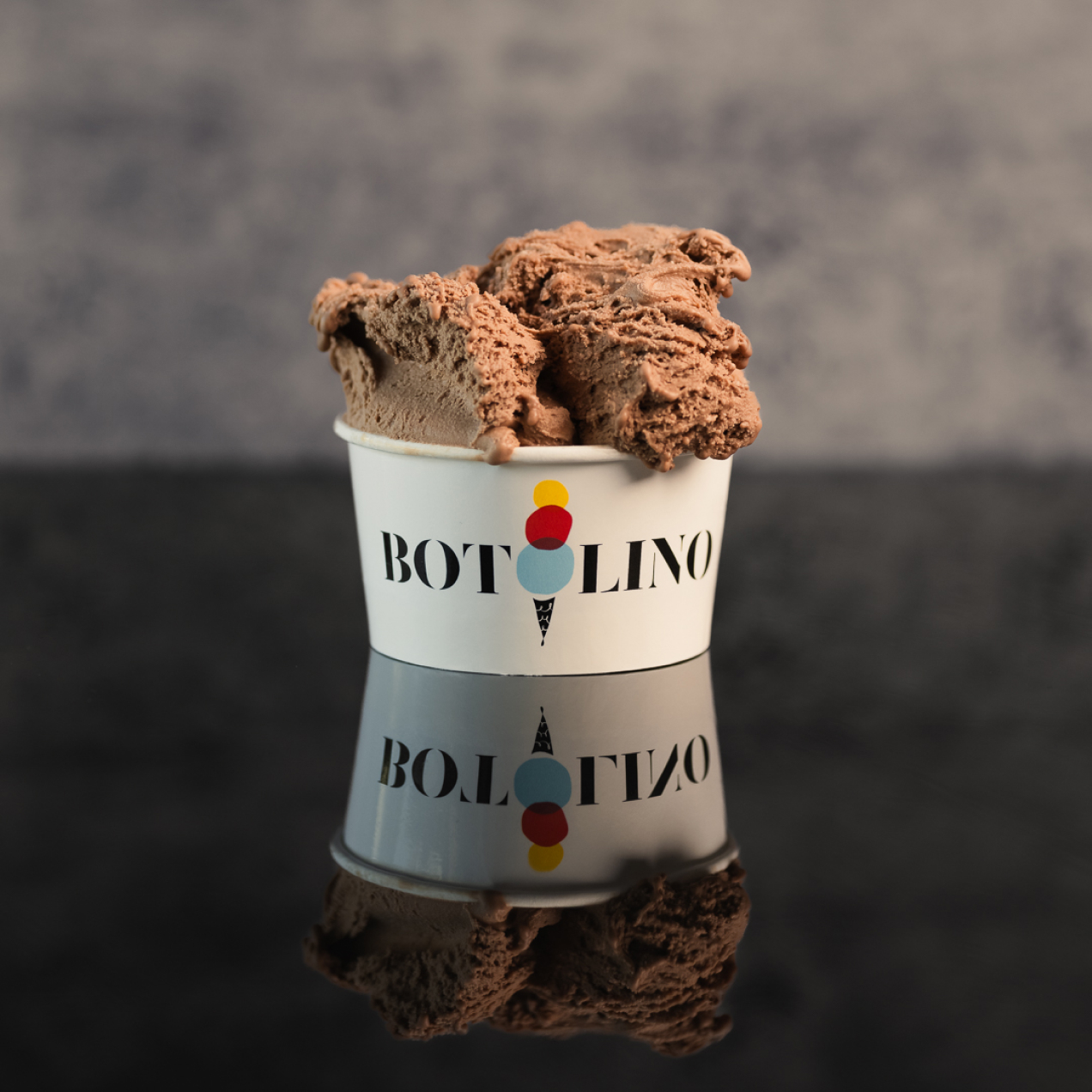 A generous cup of Botolino dark chocolate gelato, crafted from Valrhona couverture and free of artificial flavors