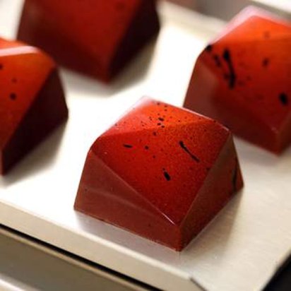 Botolino handcrafted chocolate bonbons with a deep red velvet finish