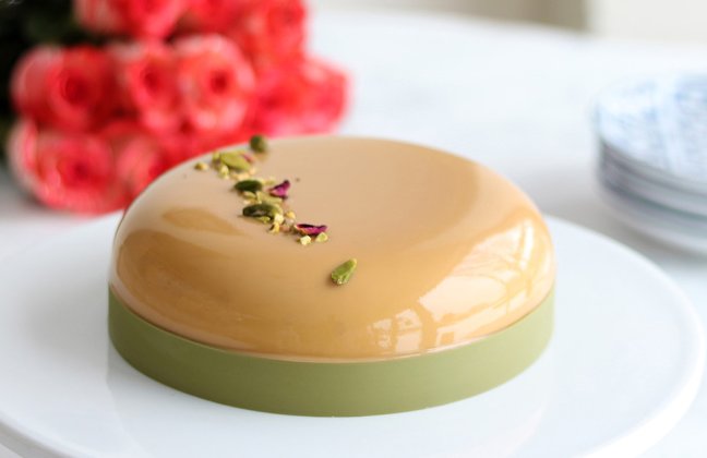Pistachio semifreddo, salted caramel gelato, caramel glaze and sponge cake with rose infusion.